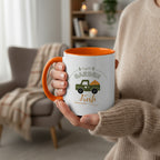 Mug with orange interior and handle, featuring a green truck and 'Garden Fresh' text on a beige background.