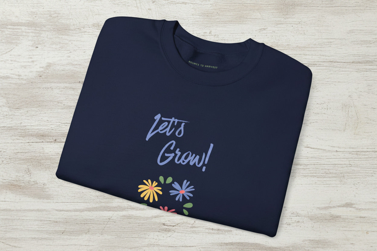 Folded green sweatshirt with a cat wizard graphic and 'GEEK' branding.