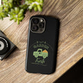 Black phone case with 'Garden Fresh' design on a wooden surface