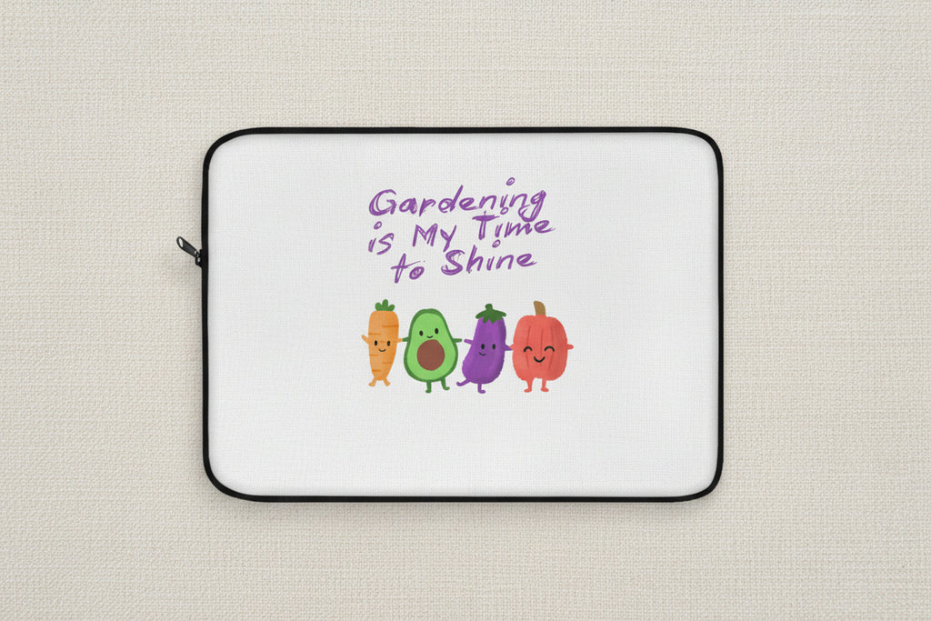 Laptop sleeve with cartoon vegetables and 'Gardening is My Time to Shine' text on a white background