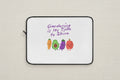 Laptop sleeve with cartoon vegetables and 'Gardening is My Time to Shine' text on a white background