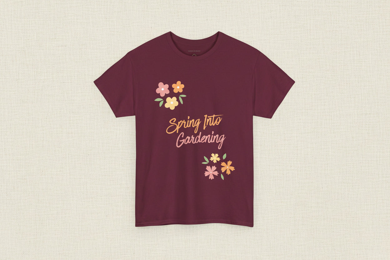 Maroon t-shirt with 'Spring Into Gardening' text and floral designs on a white background