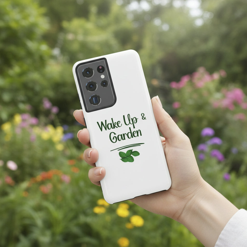 Phone case with 'Wake Up & Garden' text on a white surface with flowers