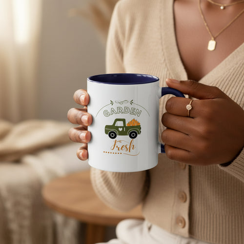 White mug with purple interior and handle featuring a green truck and 'Garden Fresh' text on a beige background
