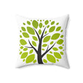 Decorative pillow with a tree design featuring green leaves on a white background