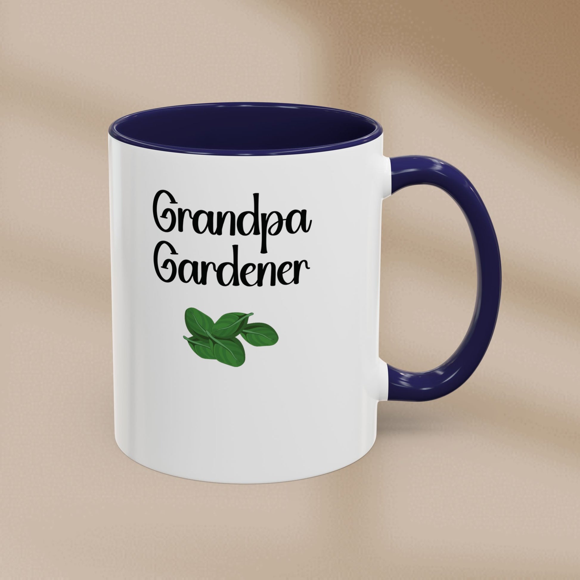Mug with 'Grandpa Gardener' text and leaf illustration on a beige background