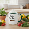 Mug with 'Daddy Gardener' text and garden illustration on a beige background