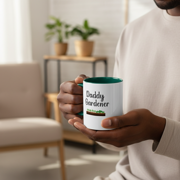 Person holding a mug with 'Daddy Gardener' text in a home setting