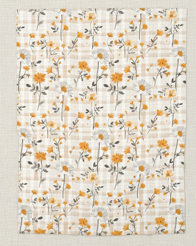 Floral patterned fabric with orange and white flowers on a beige background