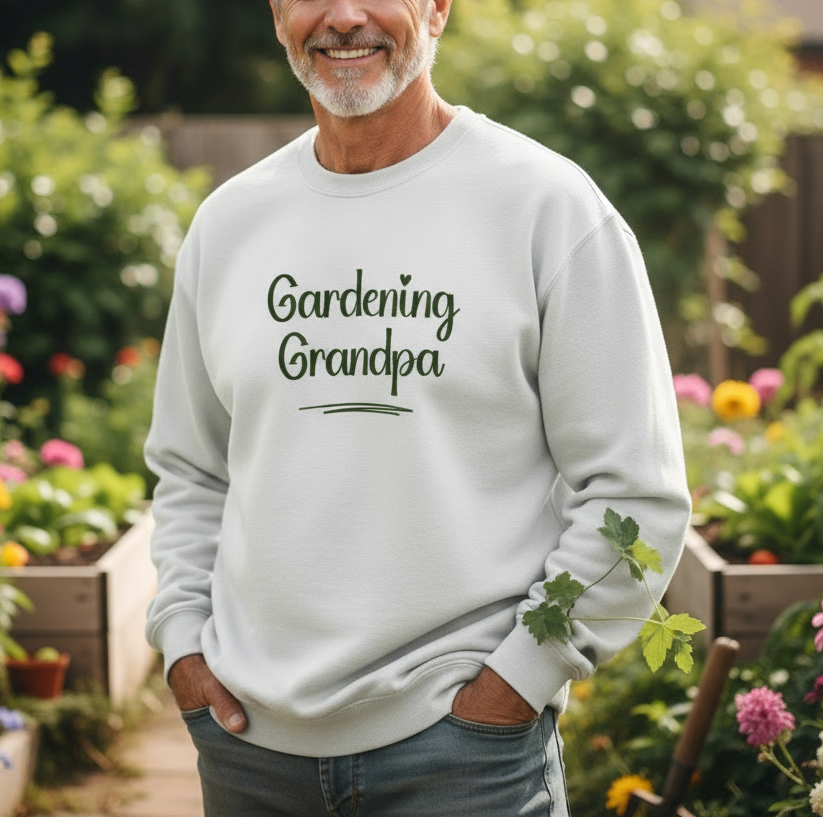 Man wearing a 'Gardening Grandpa' sweatshirt in a garden setting