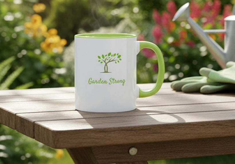White mug with green interior and handle, featuring a tree logo and 'Garden Strong' text on a beige background.