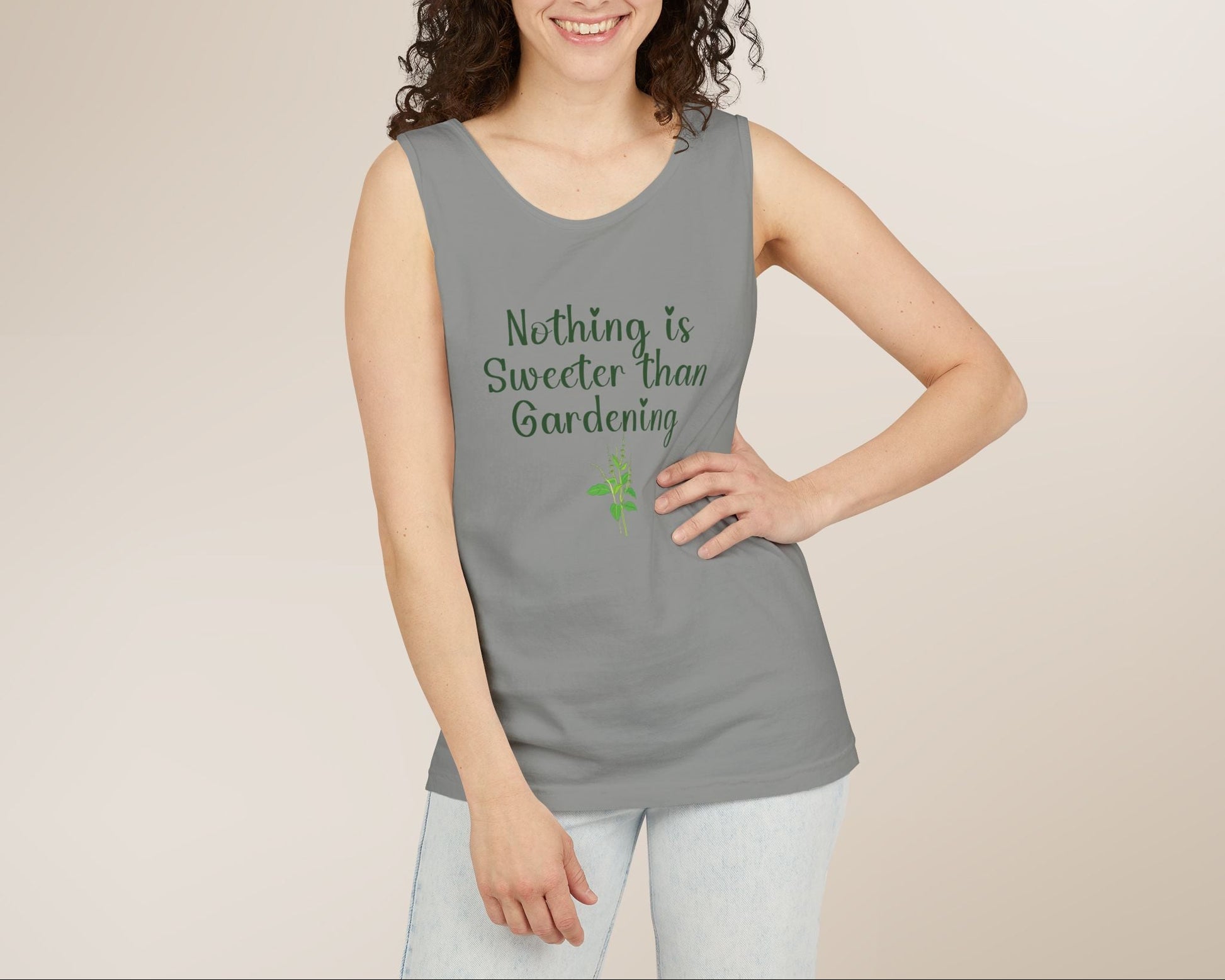 Woman wearing a gray tank top with 'Nothing is Sweeter than Gardening' text on a beige background