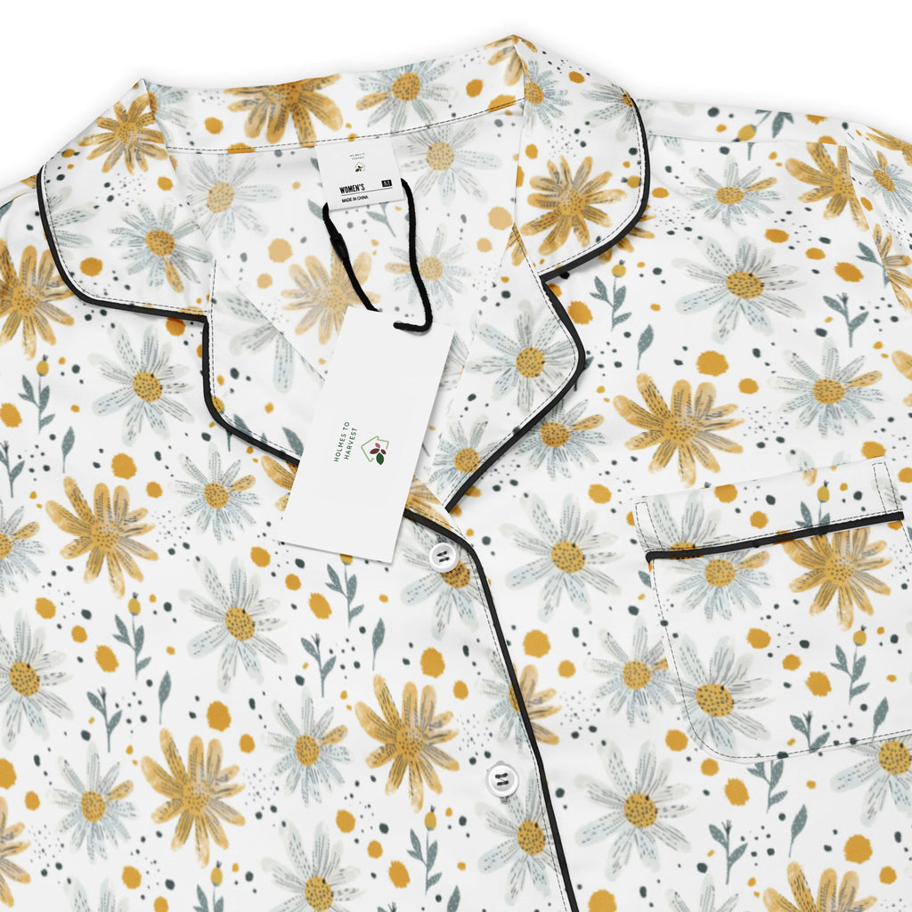 Floral patterned pajama set with a tag on a white background