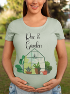 Woman wearing a light green t-shirt with 'Rise & Garden' design outdoors.