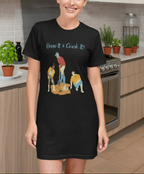 Person wearing a black t-shirt with a graphic design in a kitchen setting