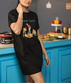 Woman wearing a black t-shirt with colorful graphics in a kitchen setting