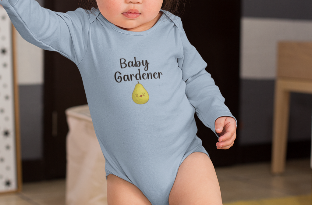 Child wearing a blue 'Baby Gardener' onesie standing with an adult's hand.