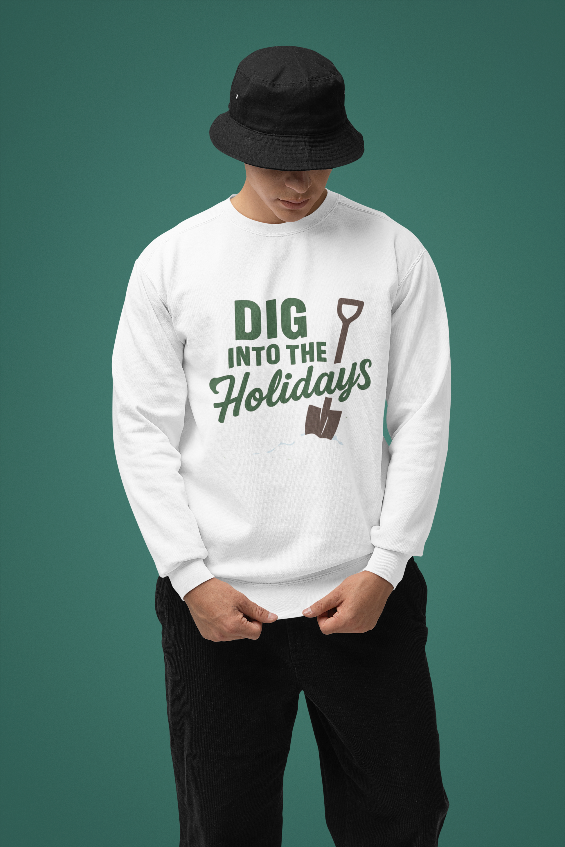 Person wearing a white sweatshirt with 'Dig into the Holidays' text and graphic on a green background