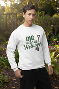 Person wearing a white sweatshirt with 'Dig into the Holidays' text and graphic on a purple background