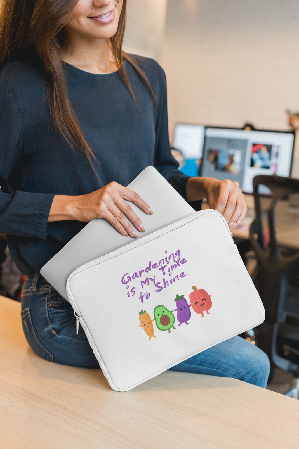 Person holding a white pouch with colorful designs and text in an indoor setting