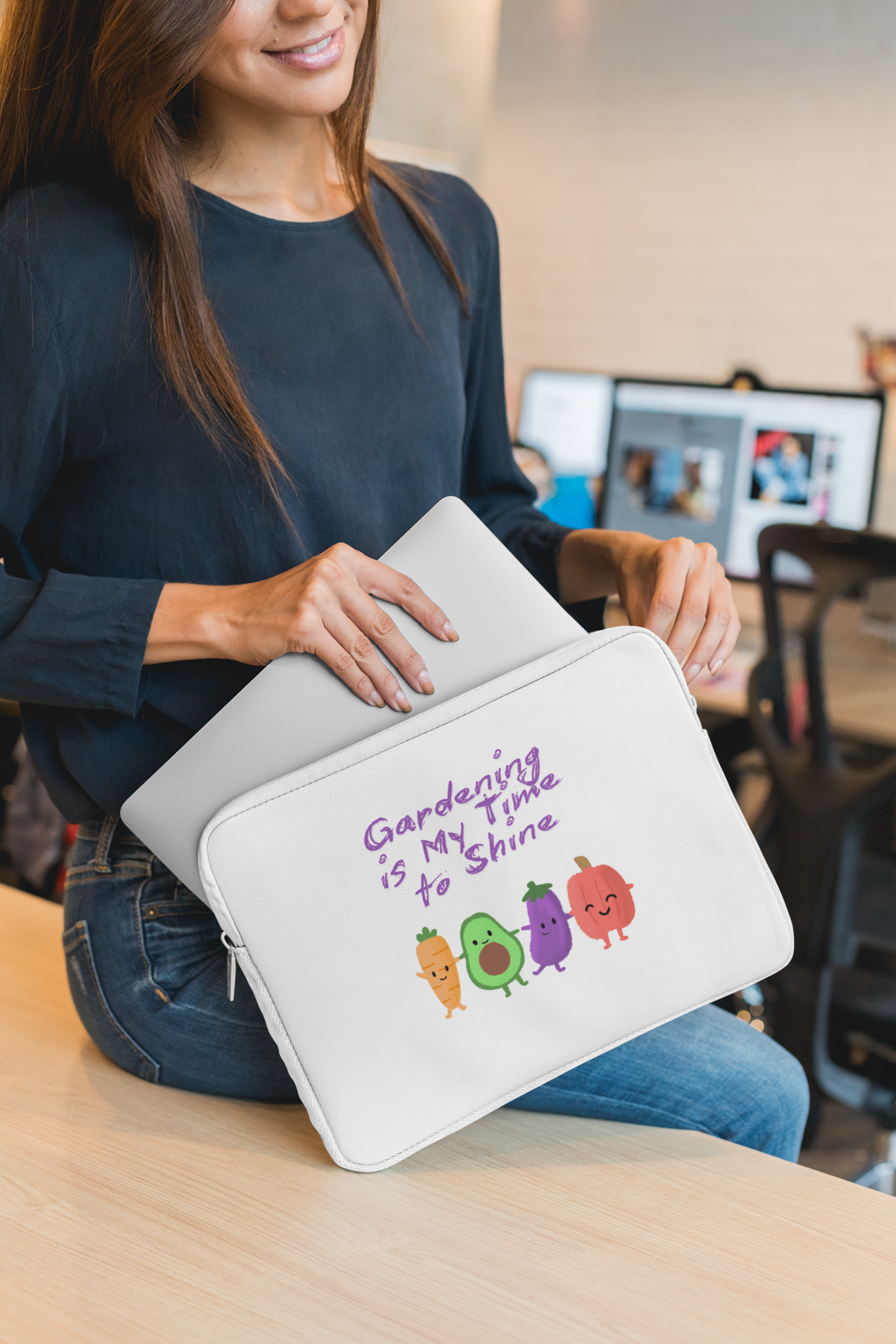 Person holding a white pouch with colorful designs and text in an indoor setting