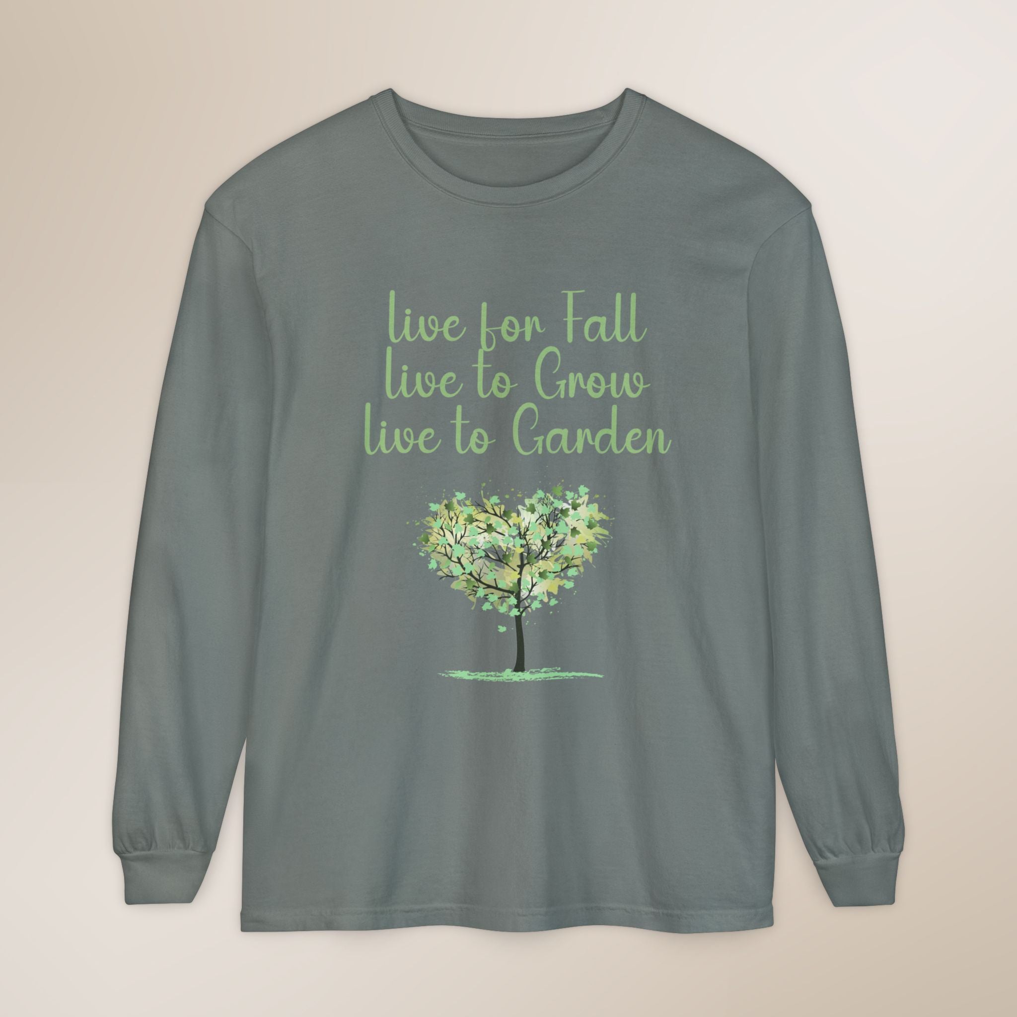 Gray long-sleeve shirt with a tree graphic and text on a beige background