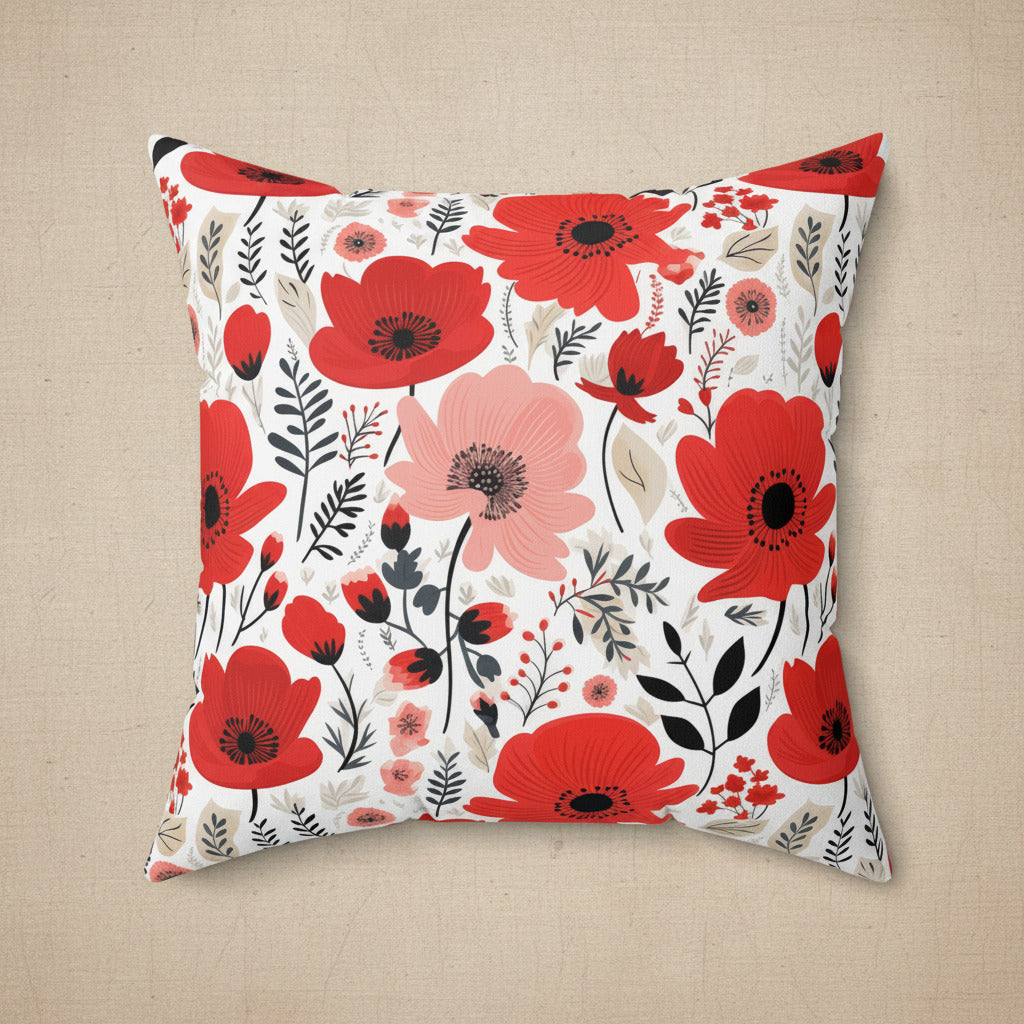 Floral pillow with red and pink flowers on a white background