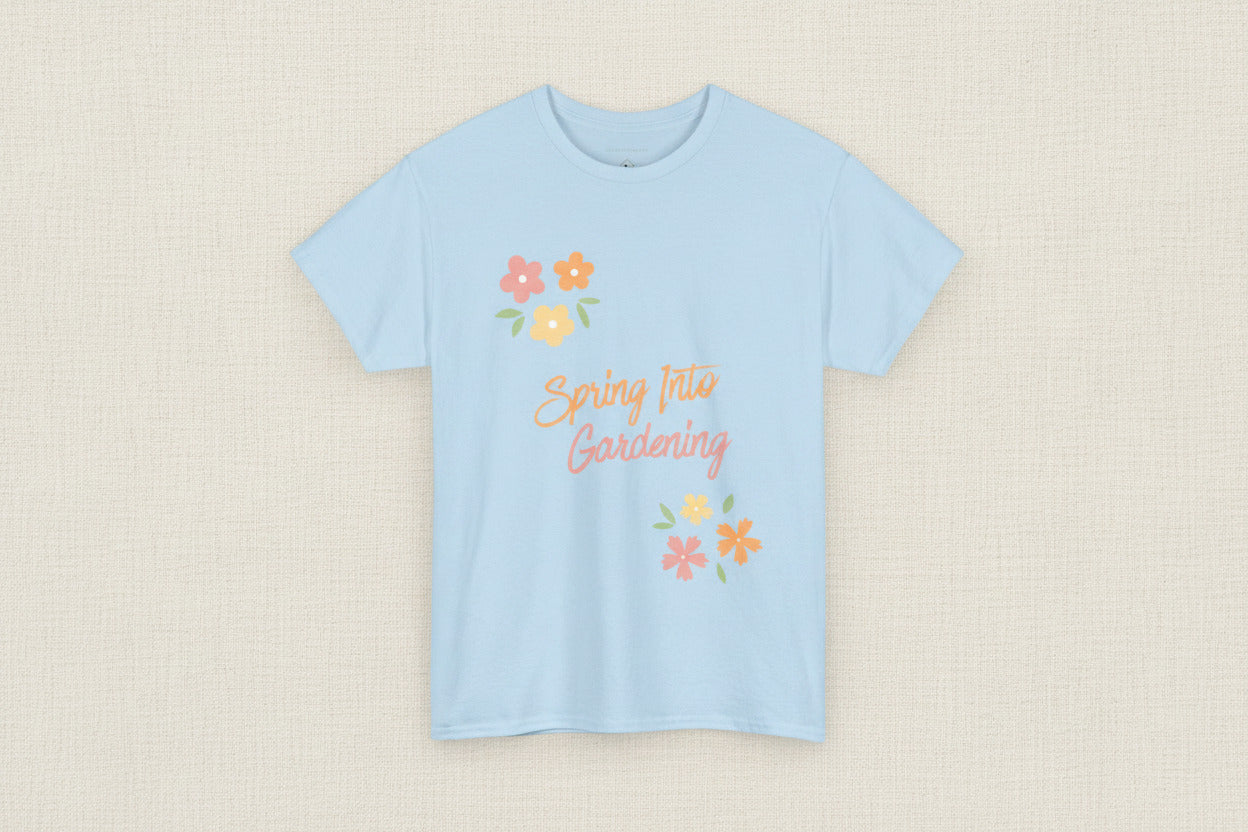 Light blue t-shirt with 'Spring Into Gardening' text and floral designs on a white background