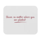White mouse pad with red text 'Bloom, no matter where you are planted!' on a white background