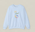 Light blue sweatshirt with 'Let's Grow!' text and floral design on a white background