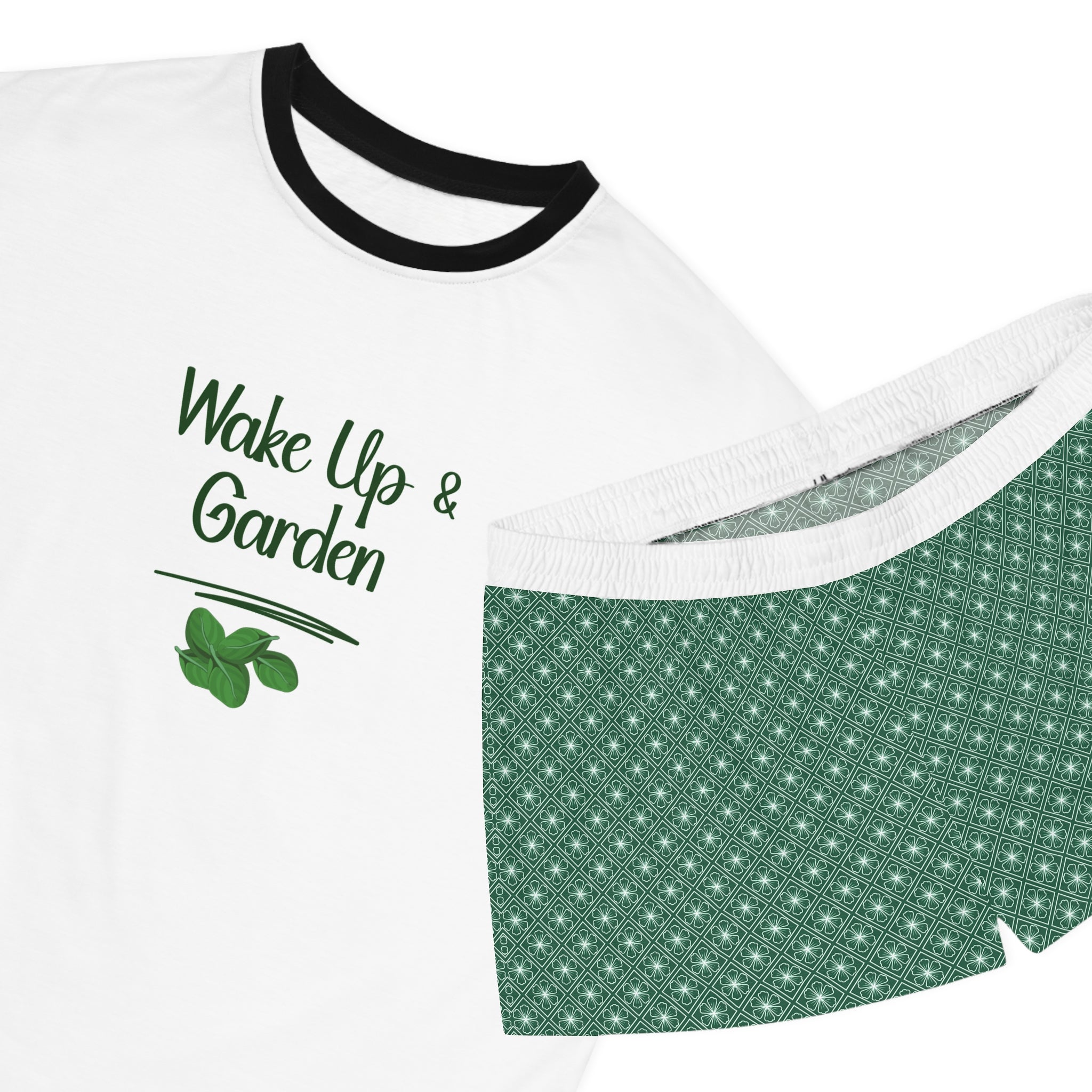 White t-shirt with black trim and green patterned shorts on a white background
