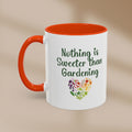 White mug with orange interior and handle, featuring a colorful heart design and text on a beige background