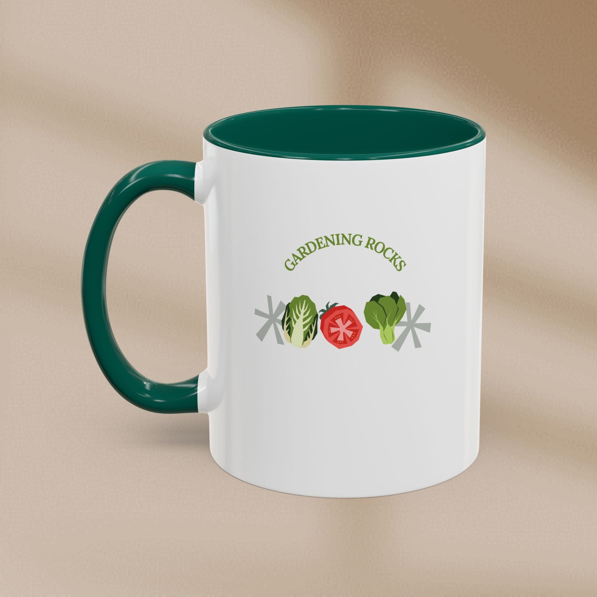 White mug with green handle featuring 'Gardening Rocks' text and vegetable icons on a beige background