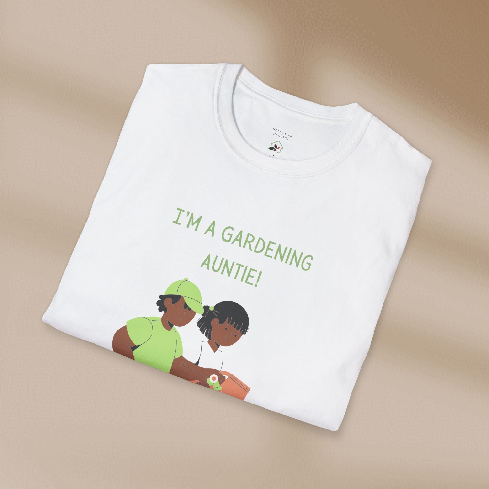 White t-shirt with graphic of two women and text 'I'm a gardening auntie!' on a beige background