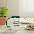 Mug with 'Daddy Gardener' text and gardening graphic on a beige background