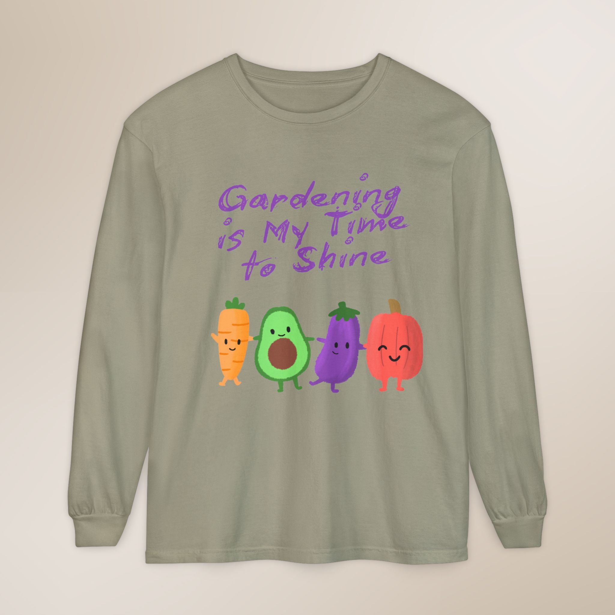 Sage green long-sleeve shirt with cartoon vegetables and text 'Gardening is My Time to Shine' on a beige background
