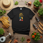 Black t-shirt with colorful floral design and text on a beige background