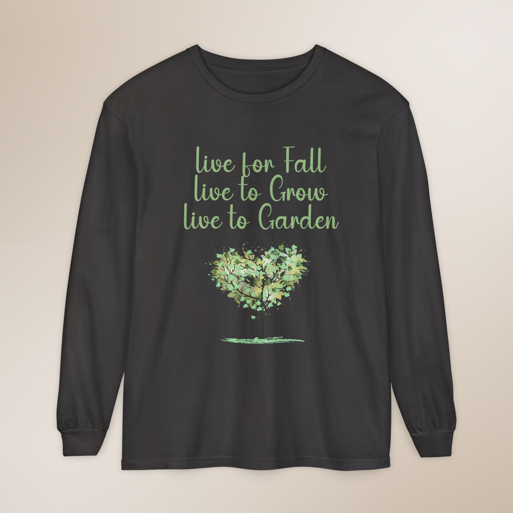 Black long-sleeve shirt with green text and heart graphic on a beige background