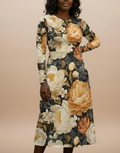 Woman wearing a floral dress with a beige background
