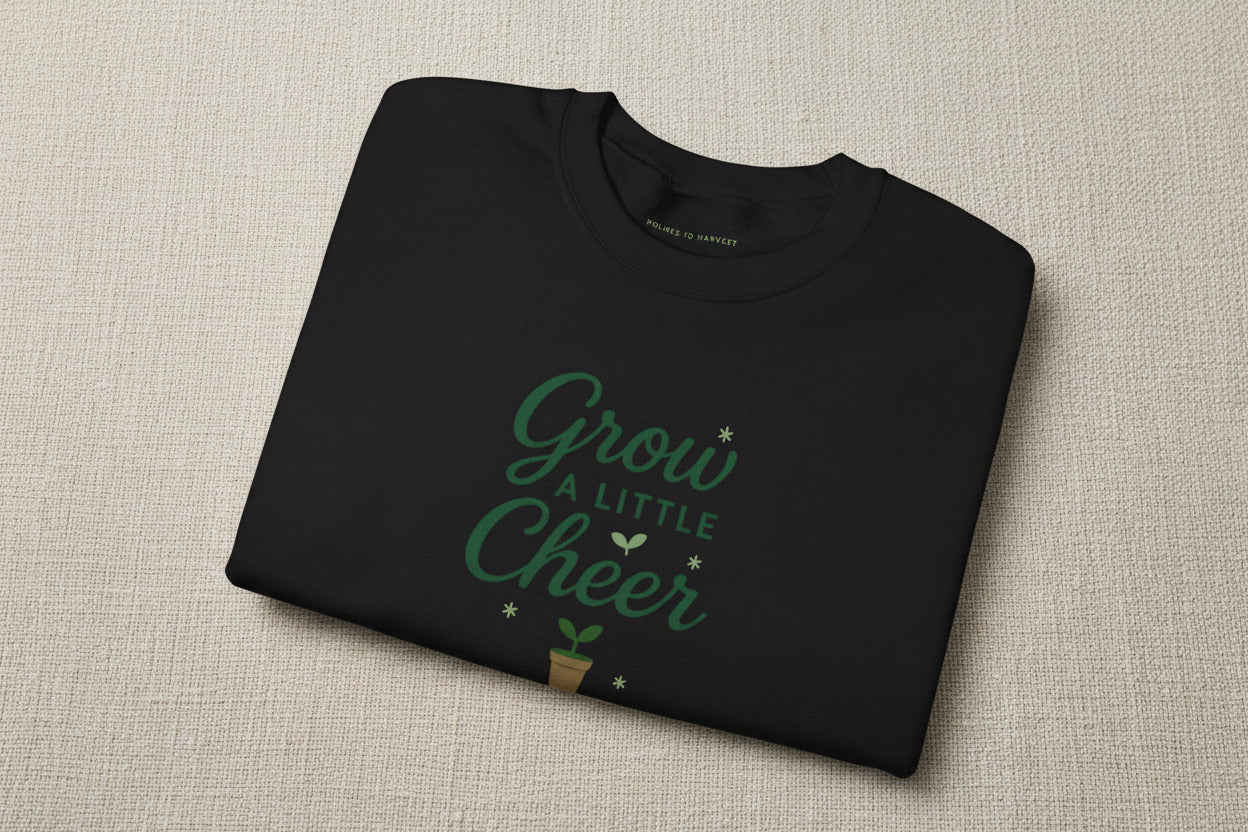 Folded black sweatshirt with 'Perfectly Imperfect' text on a white background