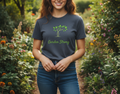 Person wearing a 'Garden Strong' t-shirt in a garden setting