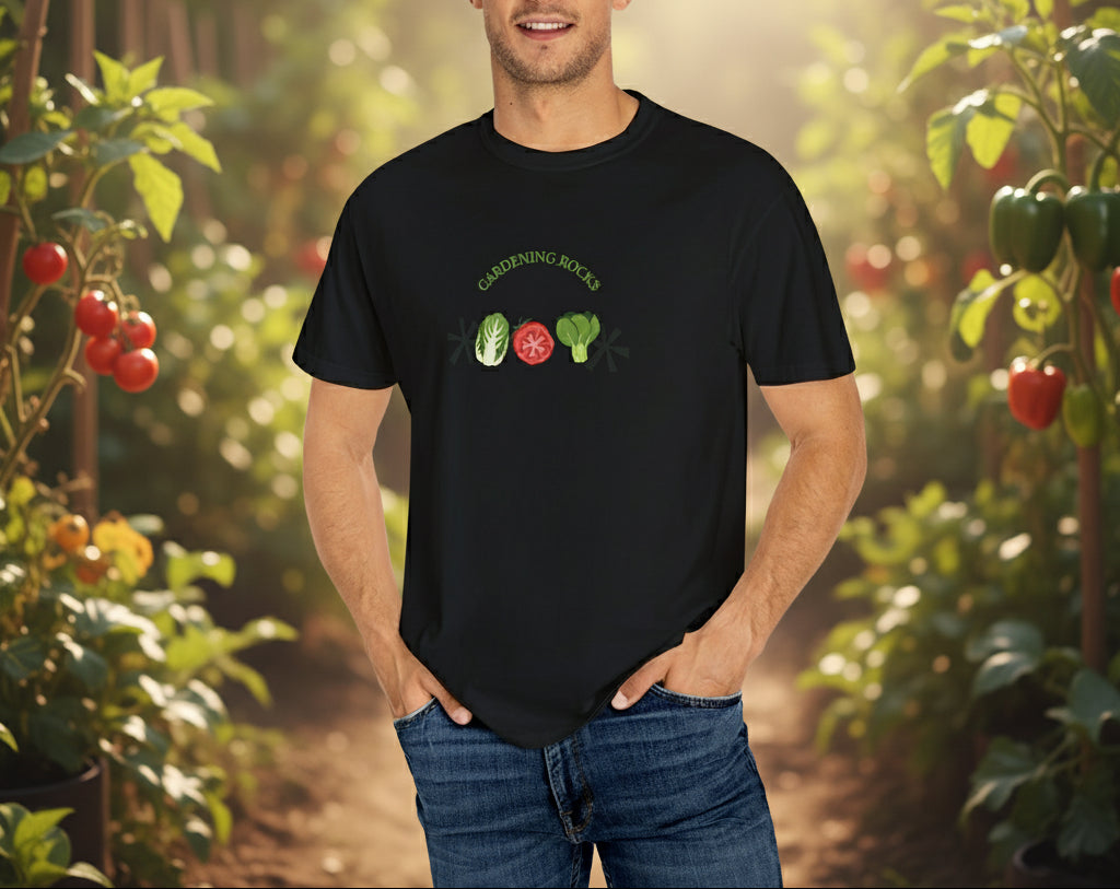 Man wearing a black t-shirt with vegetable graphics on a beige background