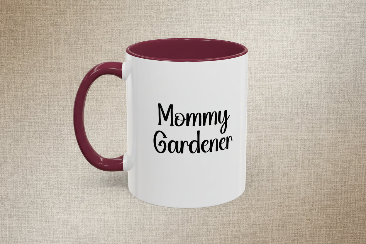 White mug with maroon handle and interior, featuring 'Mommy Gardener' text on a beige background