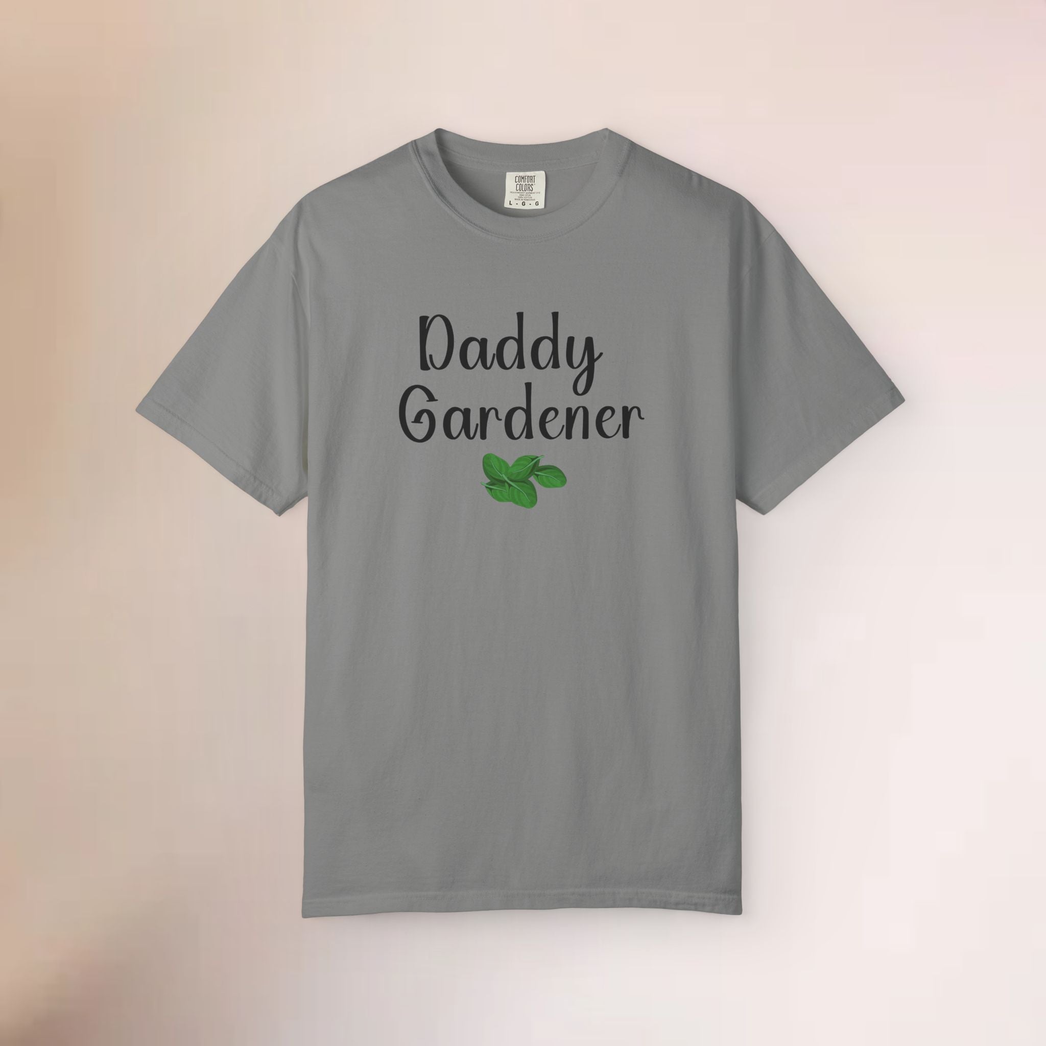 Gray t-shirt with 'Daddy Gardener' text and green leaf graphic on a gradient background