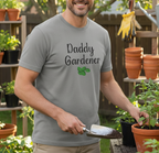 Man wearing a 'Daddy Gardener' t-shirt in a garden setting.
