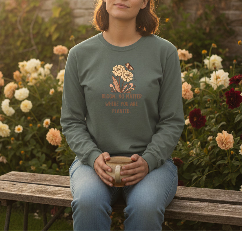 Gray long-sleeve shirt with floral design and text on a beige background
