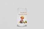Glass tumbler with a illustration of a person gardening and text 'Thankful for Gardening Friends' on a white background