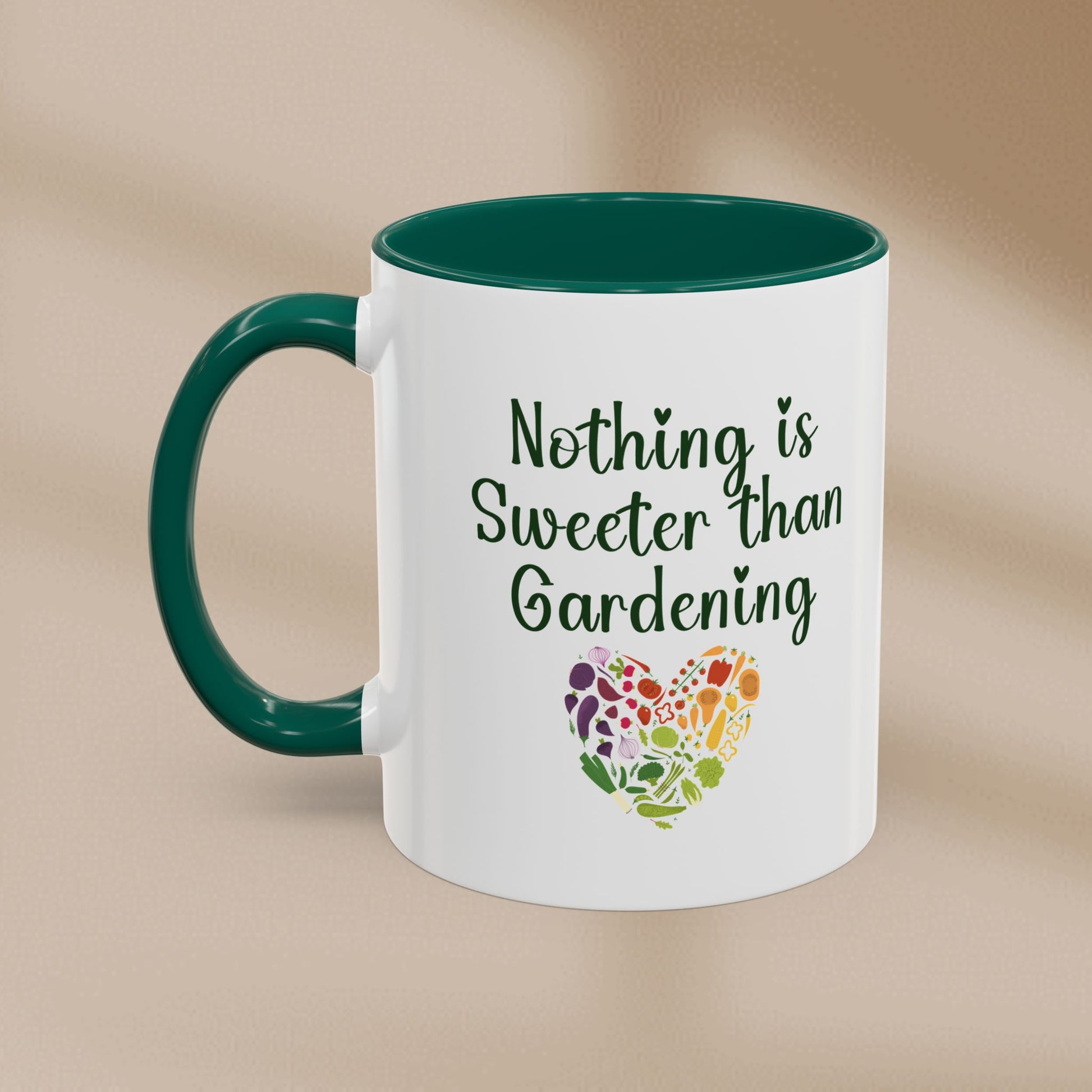 Mug with 'Nothing is Sweeter than Gardening' text and colorful heart design on a beige background