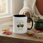 White mug with black interior and handle featuring a green truck and 'Garden Fresh' text on a beige background