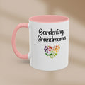 White mug with pink handle featuring 'Gardening Grandmama' text and colorful heart design on a beige background